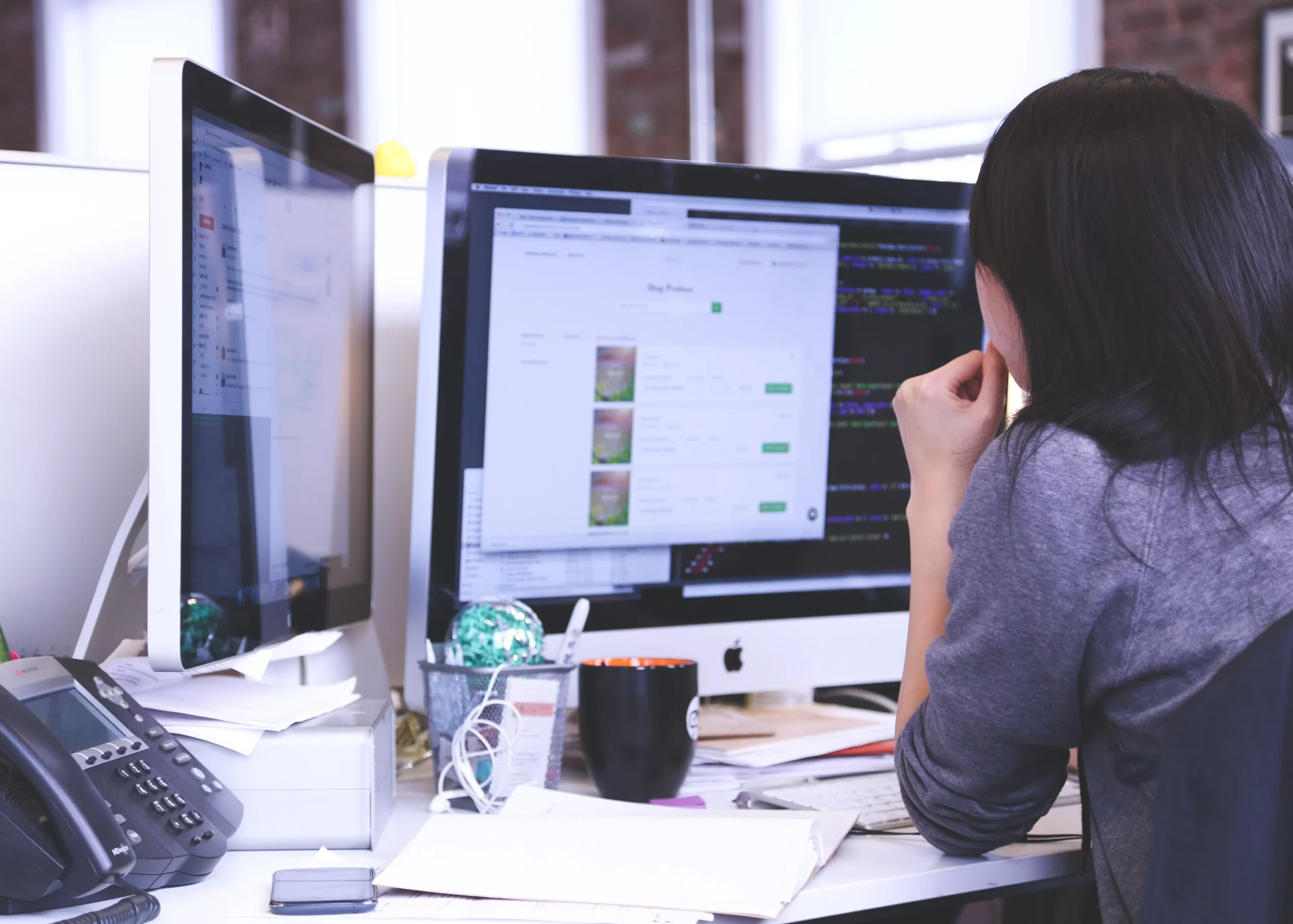 Software developer uses iMac to code.