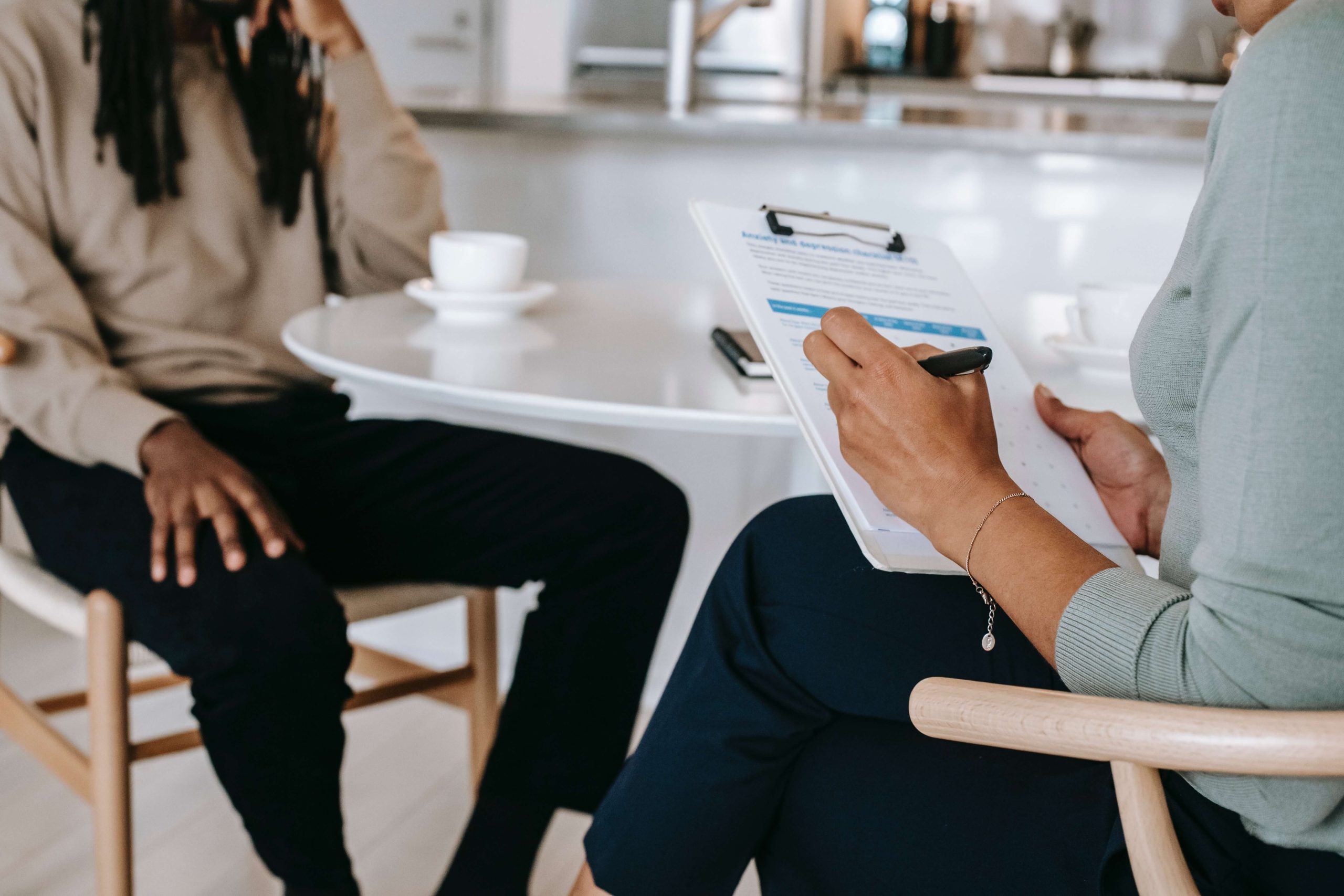 Faceless multiethnic interviewer and job seeker going through diversity recruiting interview.