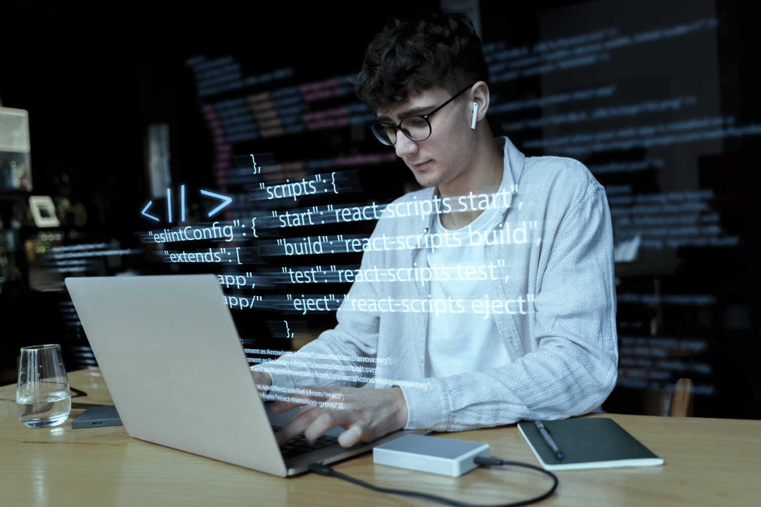 A developer coding using a laptop.