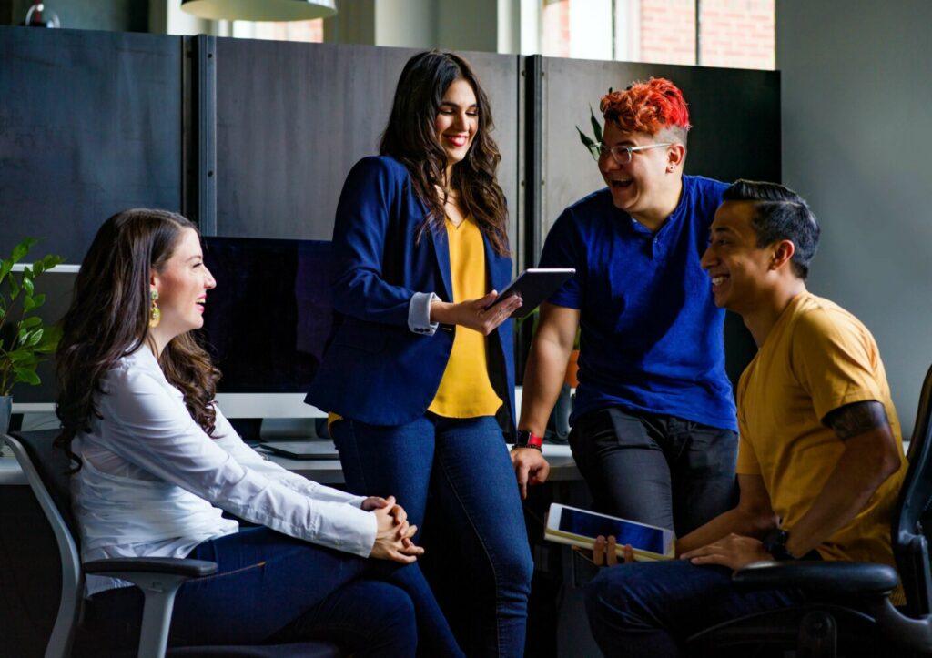 Team members smiling and having fun, demonstrating a positive company culture.